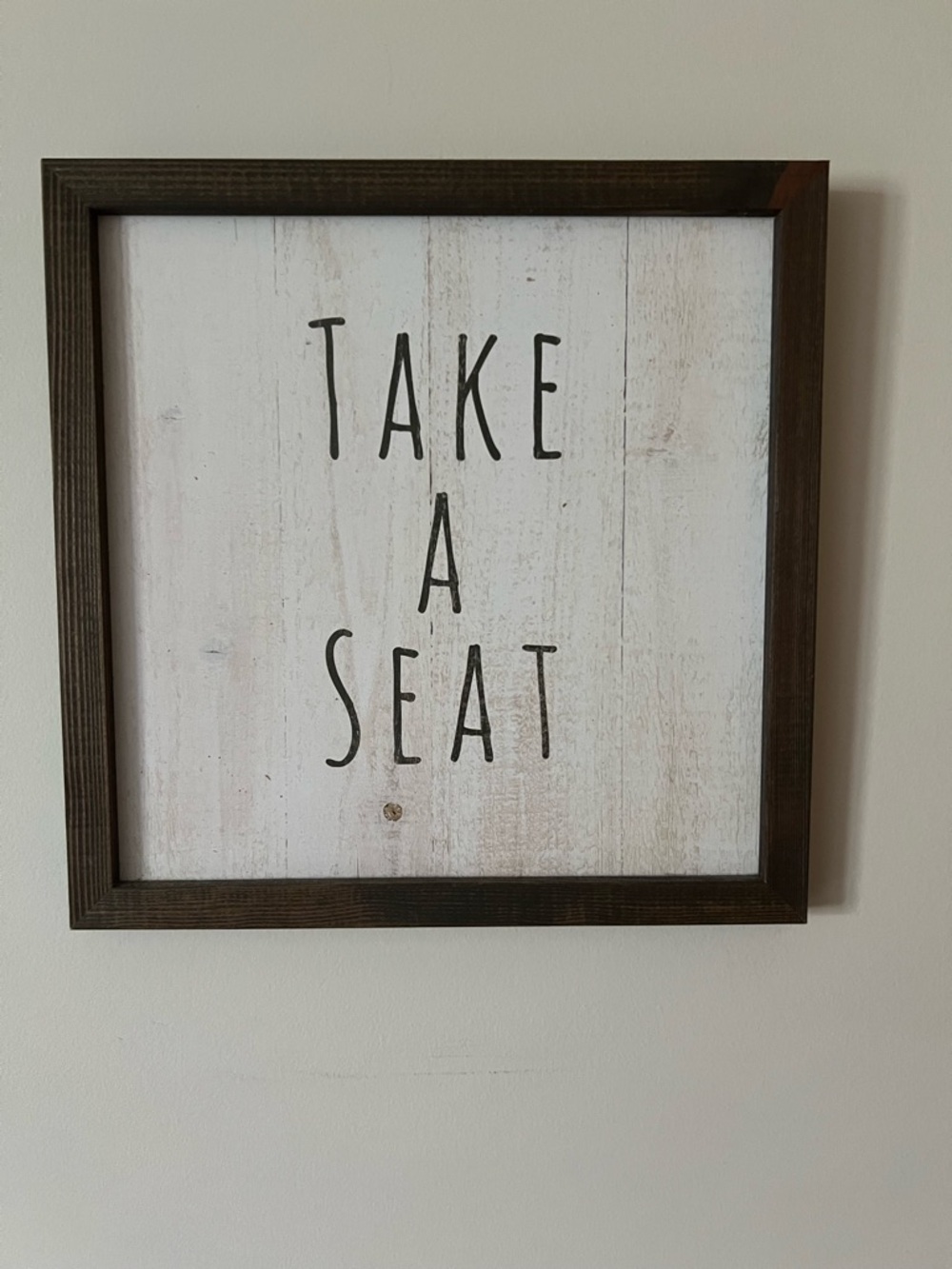 Take A Seat Framed Wall Sign - White Background with Dark Wood Frame